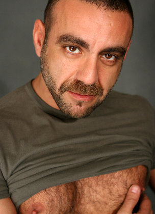 Hairy mature man Manu Maltes shows his uncut cock