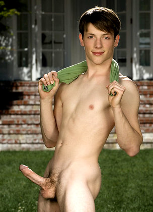 Cute twink posing on a lawn